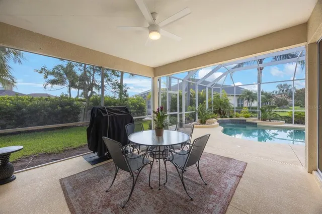 a view of a house with a yard and sitting area