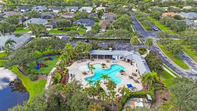 an aerial view of city and lake
