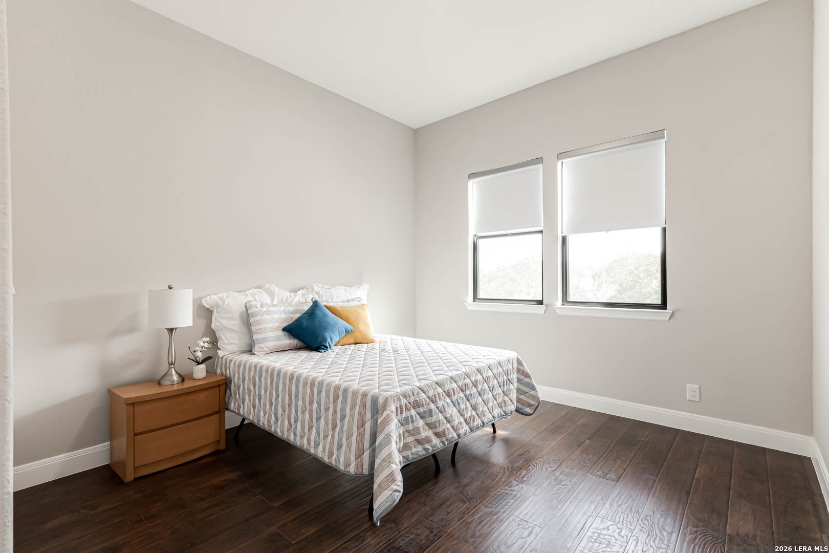 643 Mystic Parkway Spring Branch, TX 78070 - Photo 28 of 46 a bedroom with a bed and wooden floor