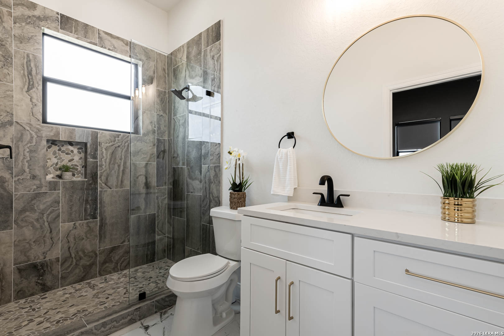 643 Mystic Parkway Spring Branch, TX 78070 - Photo 31 of 46 a bathroom with a sink a toilet and a mirror