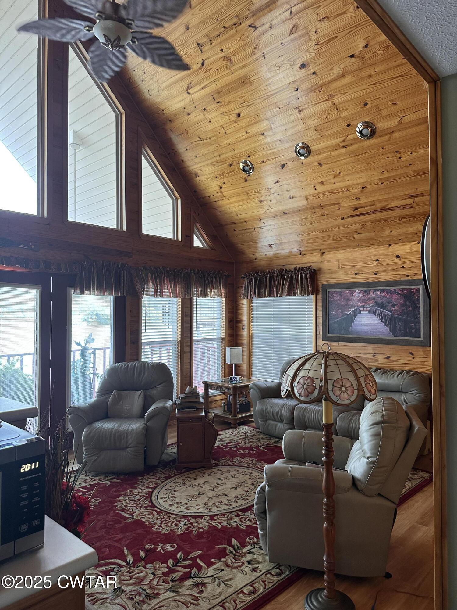 446 Miracle Road Decaturville, TN 38329 - Photo 10 of 22 a living room with furniture and a fireplace
