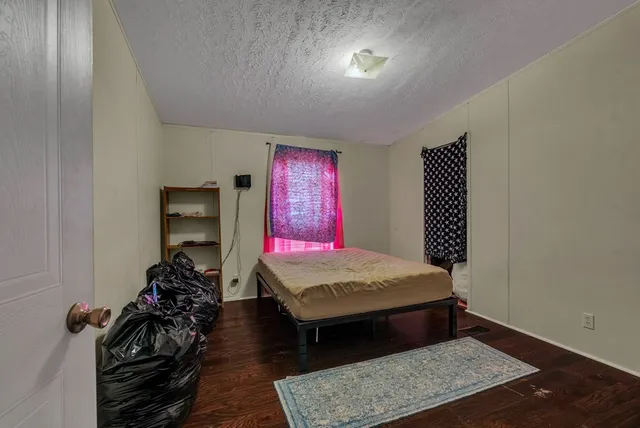 a living room with furniture rug and window