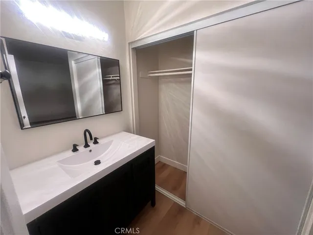 a bathroom with a sink and mirror