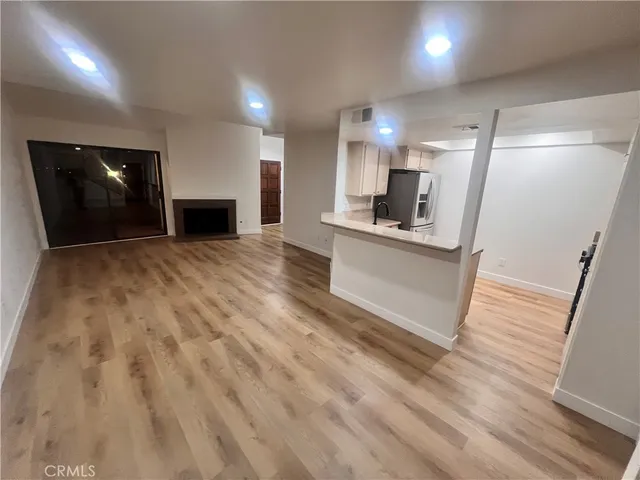 a view of kitchen with sink and microwave