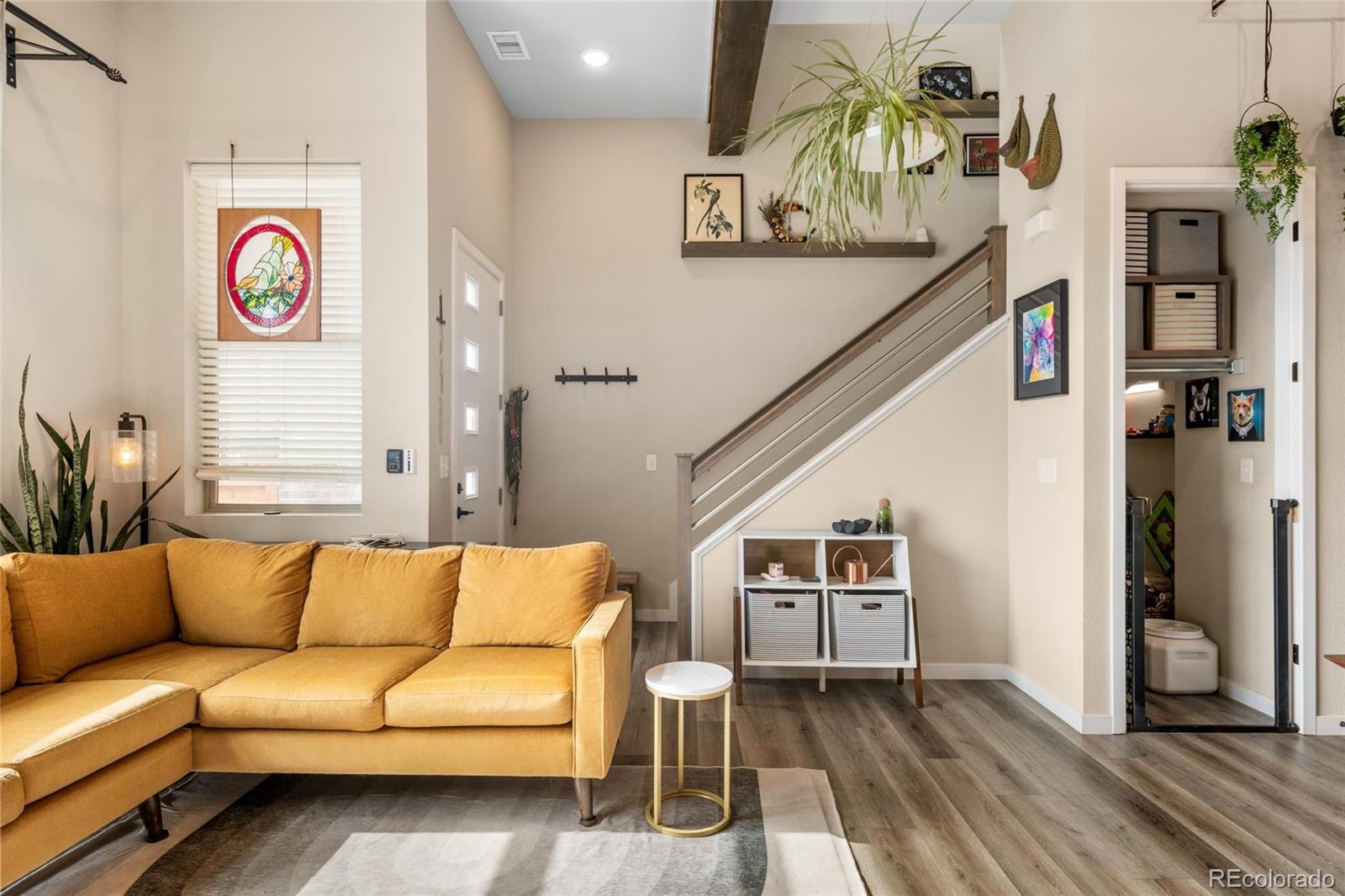 10105 Morrison Road Lakewood, CO 80227 - Photo 17 of 34 a living room with furniture and a wooden floor
