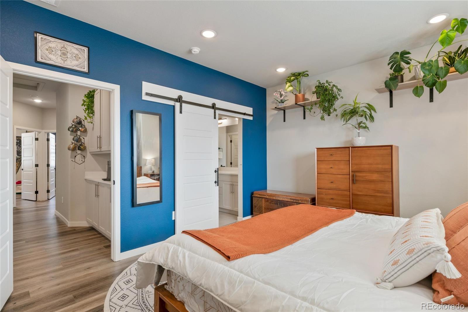 10105 Morrison Road Lakewood, CO 80227 - Photo 24 of 34 a bedroom with a bed and a dresser