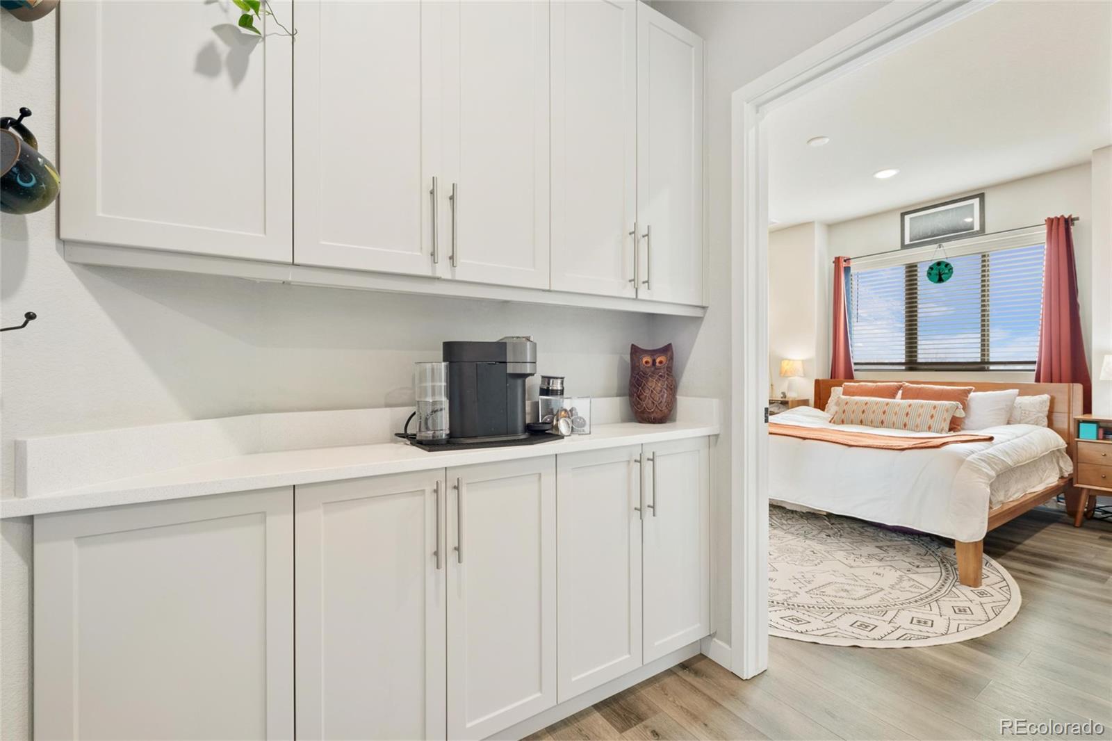 10105 Morrison Road Lakewood, CO 80227 - Photo 28 of 34 a living room with furniture and a wooden floor