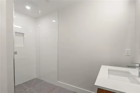 a bathroom with a sink and shower