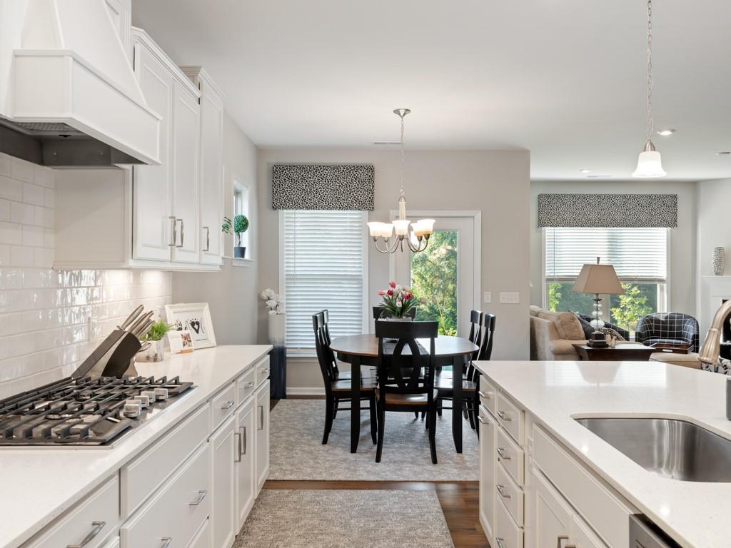 5292 Sweet Fig Way Fort Mill, SC 29715 - Photo 1 of 36 a kitchen with granite countertop sink and cabinets