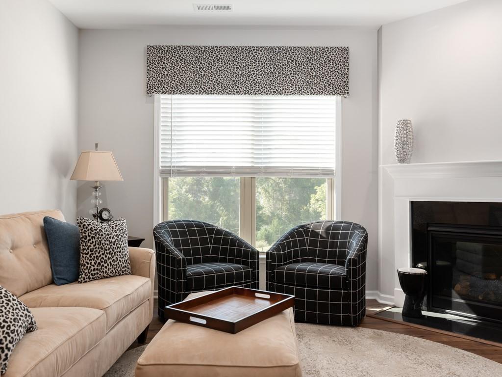5292 Sweet Fig Way Fort Mill, SC 29715 - Photo 11 of 36 a living room with furniture a window and a fireplace