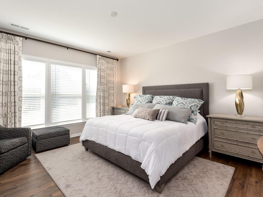 5292 Sweet Fig Way Fort Mill, SC 29715 - Photo 13 of 36 a bedroom with a bed couch and a large window