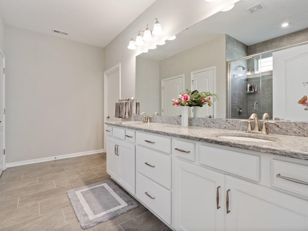 5292 Sweet Fig Way Fort Mill, SC 29715 - Photo 15 of 36 a bathroom with a double vanity sink and a mirror