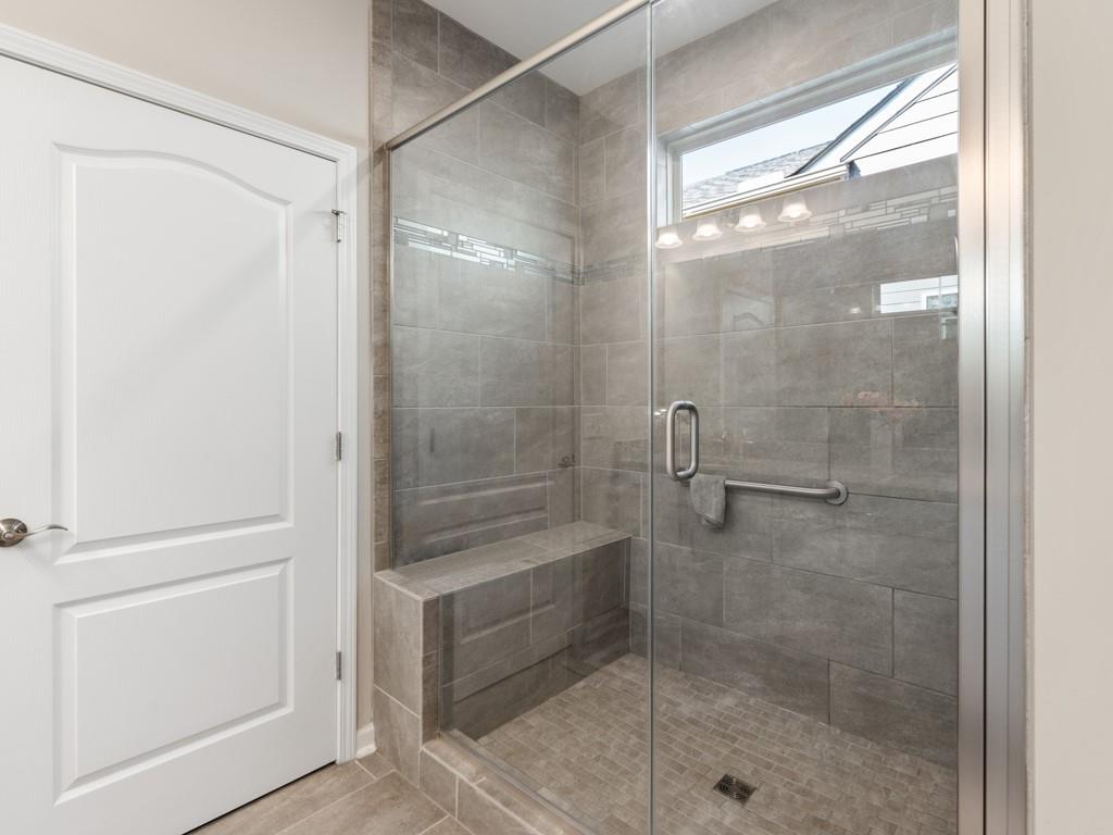 5292 Sweet Fig Way Fort Mill, SC 29715 - Photo 16 of 36 a bathroom with a glass shower door