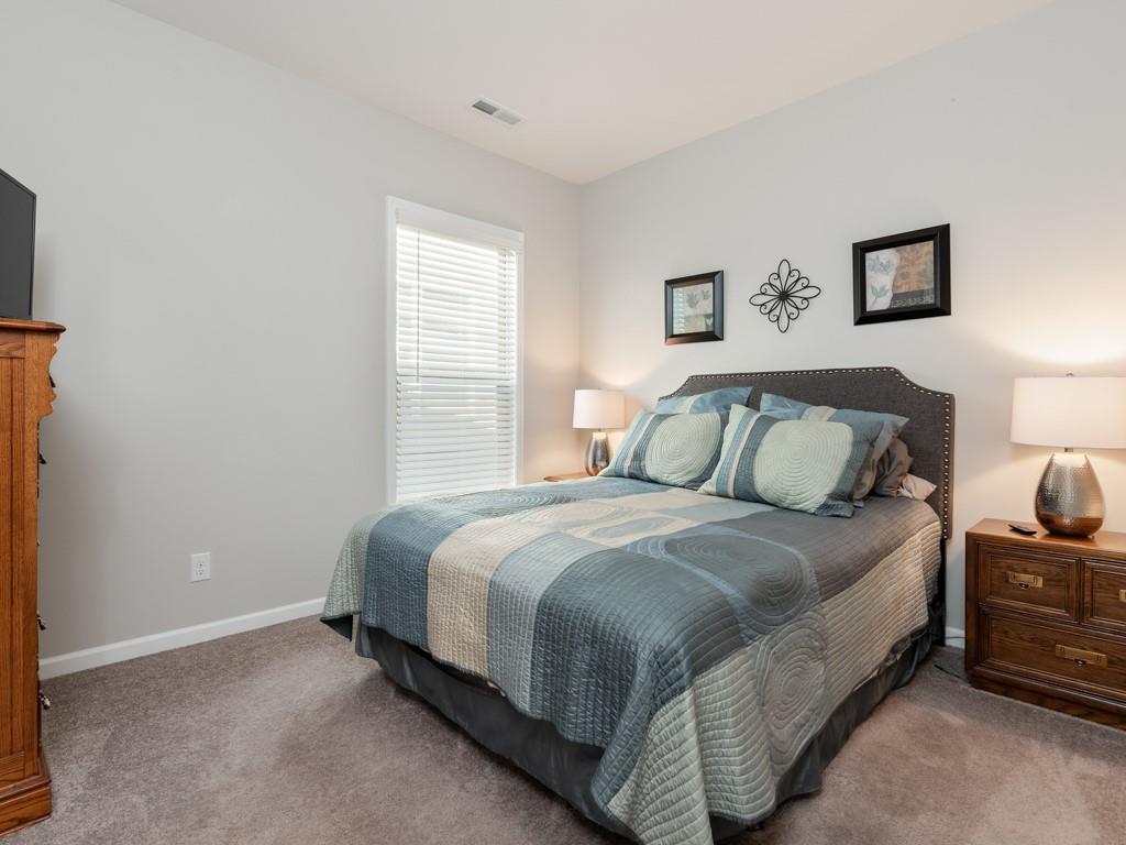 5292 Sweet Fig Way Fort Mill, SC 29715 - Photo 21 of 36 a bedroom with a bed and window