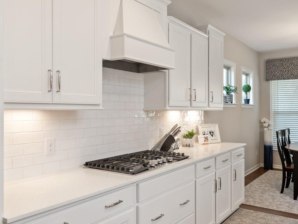5292 Sweet Fig Way Fort Mill, SC 29715 - Photo 3 of 36 a kitchen with white cabinets and appliances