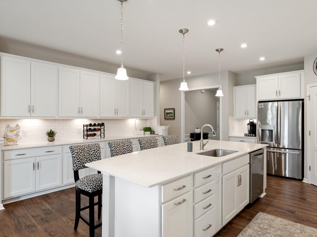 5292 Sweet Fig Way Fort Mill, SC 29715 - Photo 4 of 36 a kitchen that has a lot of white cabinets and stainless steel appliances