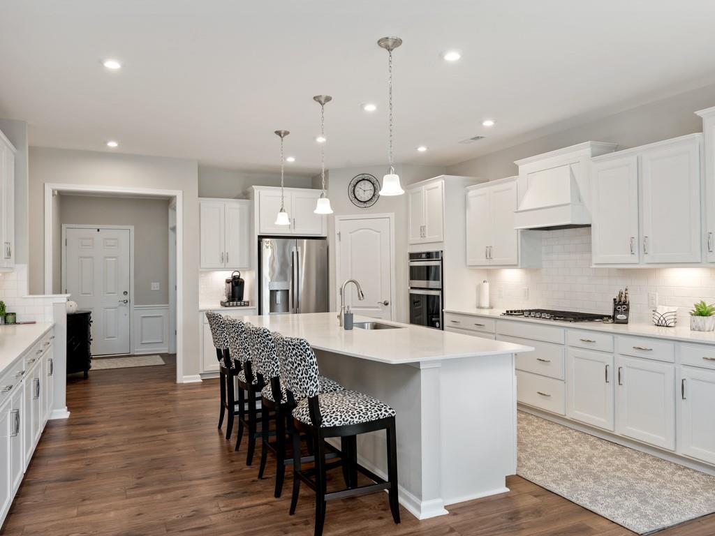 5292 Sweet Fig Way Fort Mill, SC 29715 - Photo 5 of 36 a large kitchen with a table and chairs