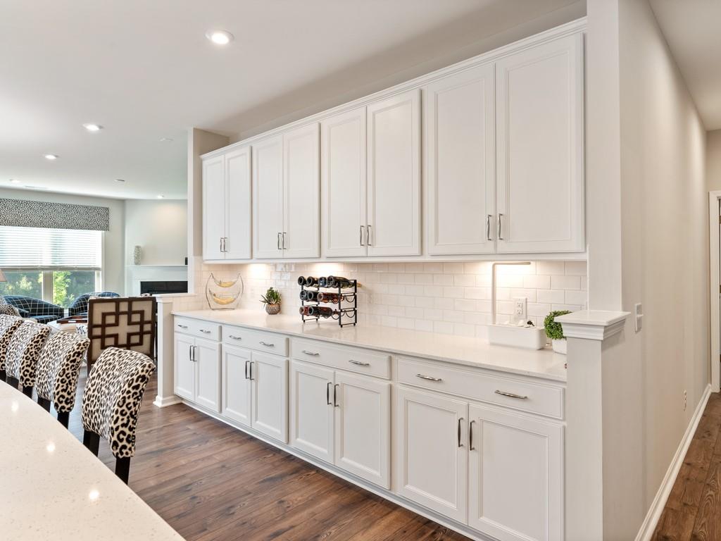 5292 Sweet Fig Way Fort Mill, SC 29715 - Photo 6 of 36 a kitchen with white cabinets and sink