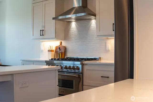 a kitchen with a stove and a sink
