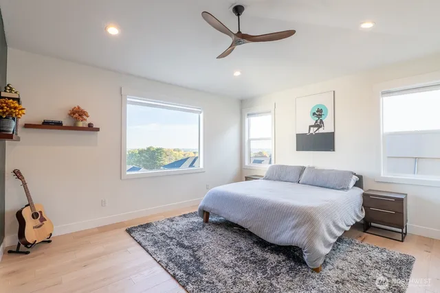 a bedroom with a bed and a window