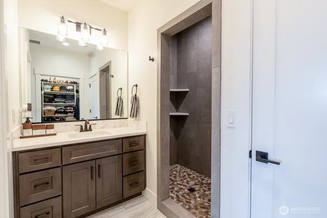 a bathroom with a sink and a mirror
