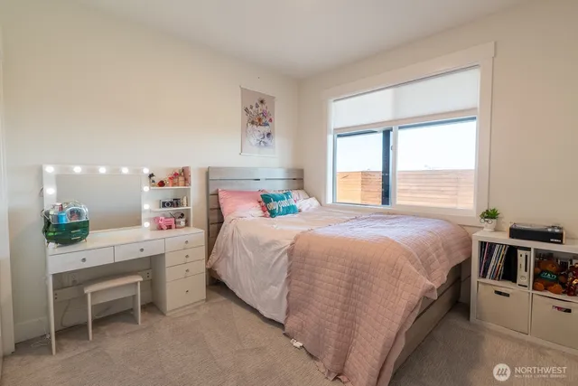 a bed room with a bed and a window