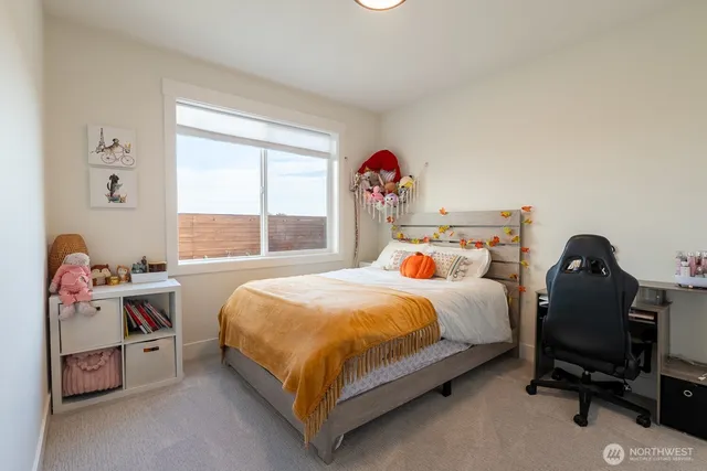 a bed room with a bed and a window