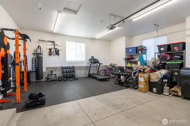 a view of a garage with a lot of stuff and furniture