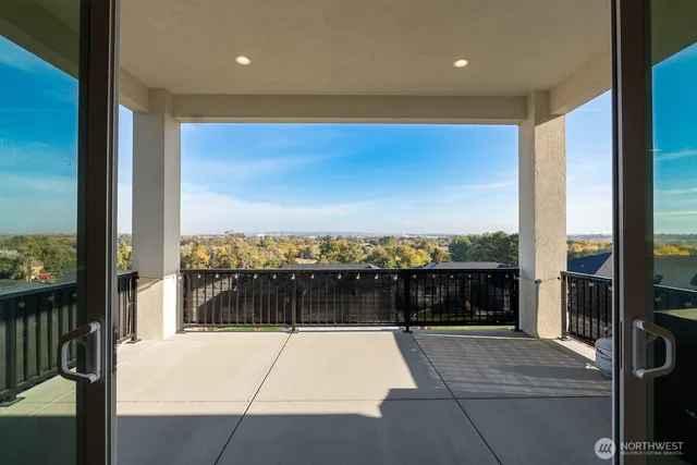 a view of balcony with furniture