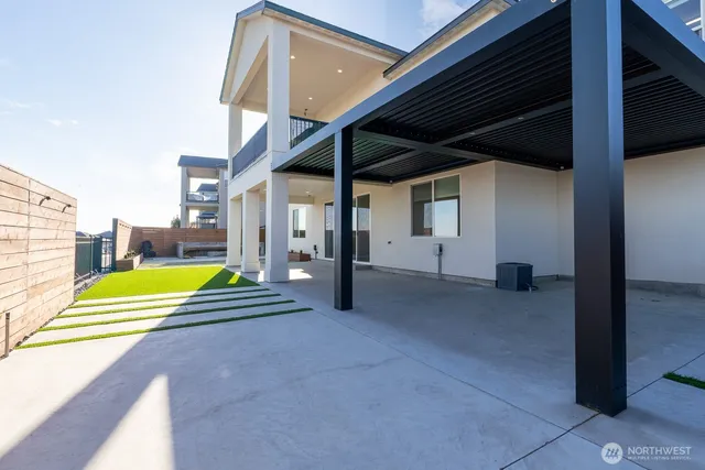 a view of swimming pool with seating area