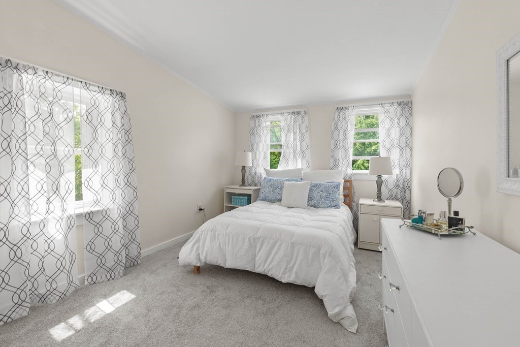 38 Elm Street Georgetown, MA 01833 - Photo 20 of 41 a bedroom with a bed and window