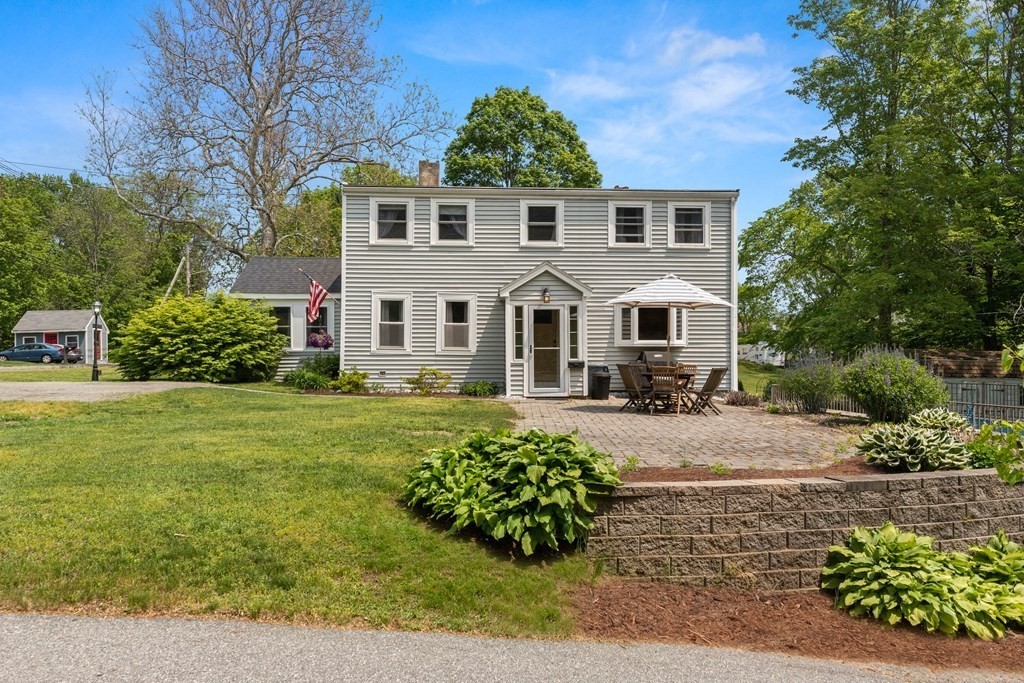 38 Elm Street Georgetown, MA 01833 - Photo 2 of 41 a front view of a house with garden