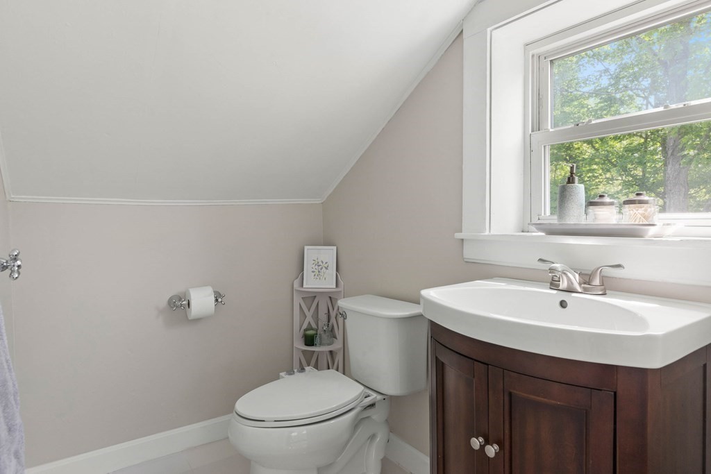 38 Elm Street Georgetown, MA 01833 - Photo 21 of 41 a bathroom with a sink a toilet and a window