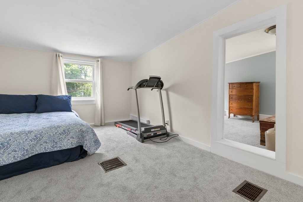 38 Elm Street Georgetown, MA 01833 - Photo 23 of 41 a bedroom with a bed and a window