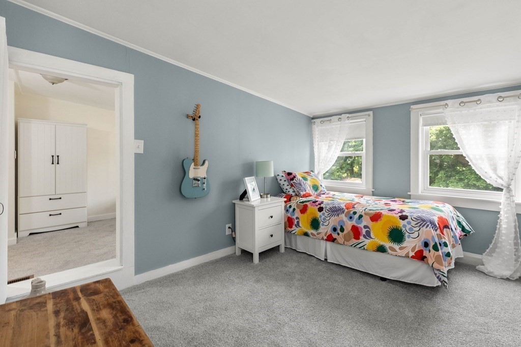 38 Elm Street Georgetown, MA 01833 - Photo 25 of 41 a bedroom with a bed and window