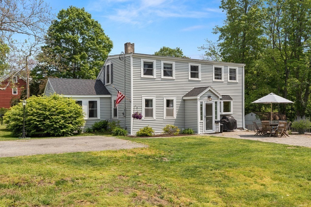 38 Elm Street Georgetown, MA 01833 - Photo 27 of 41 a front view of a house with a yard