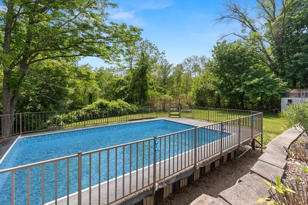 38 Elm Street Georgetown, MA 01833 - Photo 31 of 41 a view of a swimming pool with a patio
