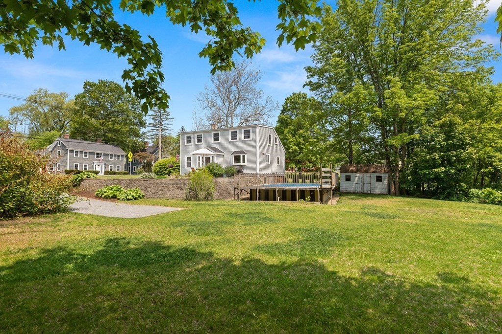 38 Elm Street Georgetown, MA 01833 - Photo 33 of 41 a view of a house with a big yard and palm trees