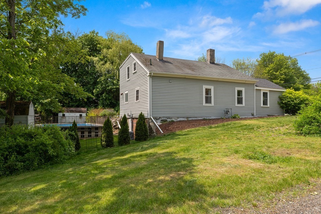 38 Elm Street Georgetown, MA 01833 - Photo 35 of 41 a view of a house with a yard