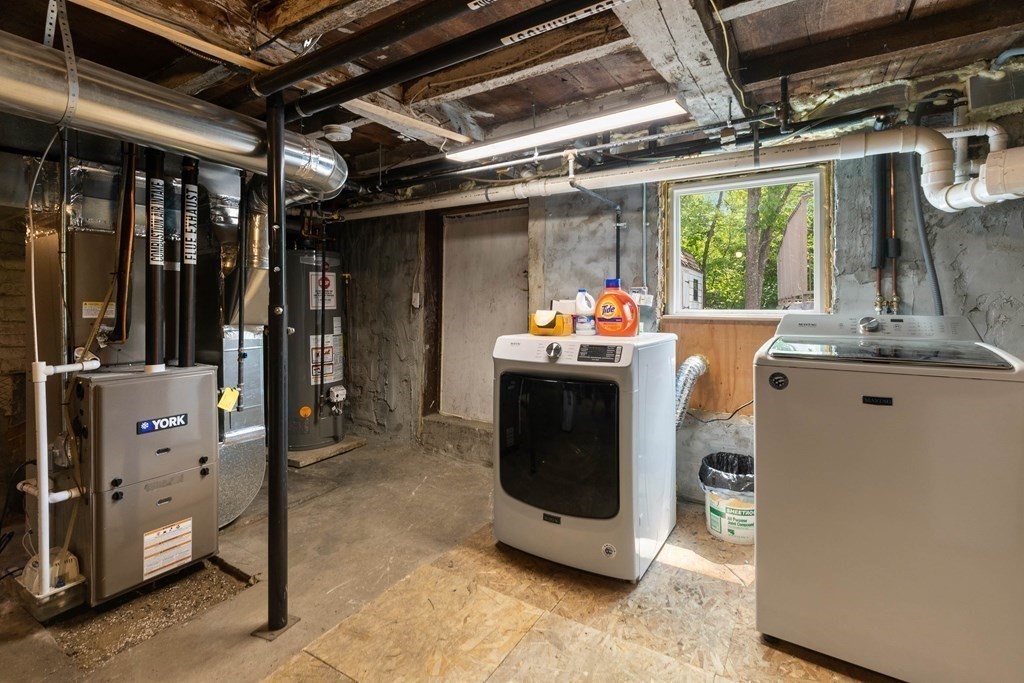 38 Elm Street Georgetown, MA 01833 - Photo 36 of 41 a view of a storage room with washer and dryer