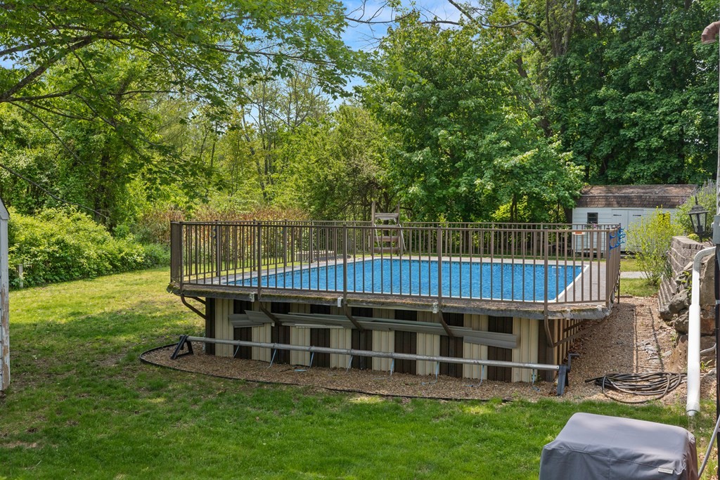 38 Elm Street Georgetown, MA 01833 - Photo 38 of 41 a view of a wooden deck and a big yard