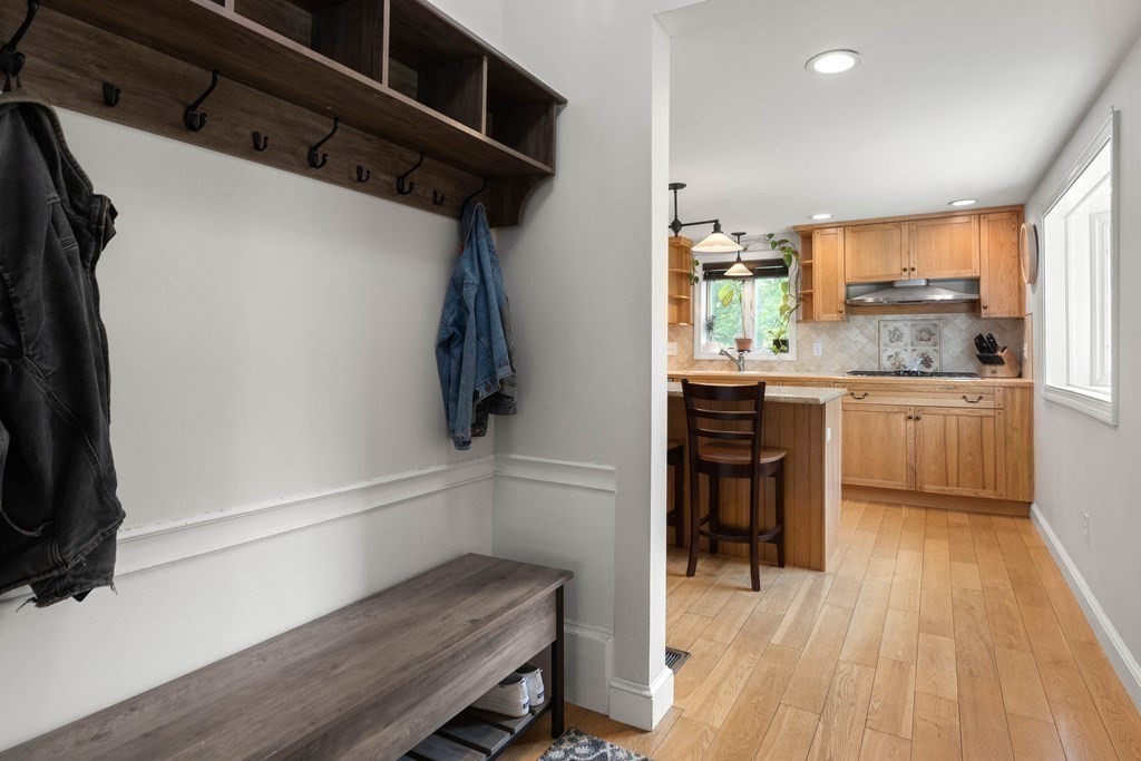 38 Elm Street Georgetown, MA 01833 - Photo 4 of 41 a kitchen with a refrigerator and wooden floor
