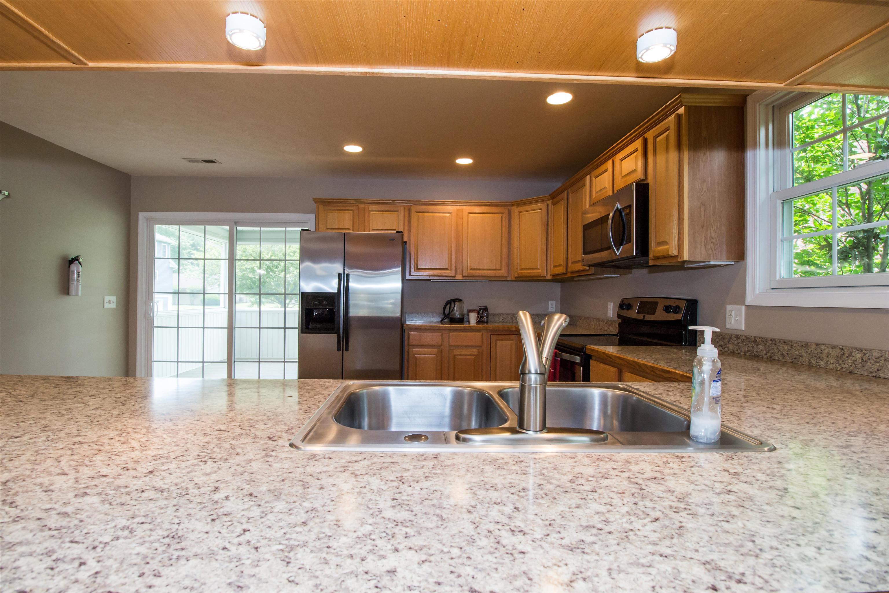302 A North River Road Bridgewater, VA 22812 - Photo 15 of 24 a kitchen with stainless steel appliances granite countertop a refrigerator a sink a stove and a microwave oven