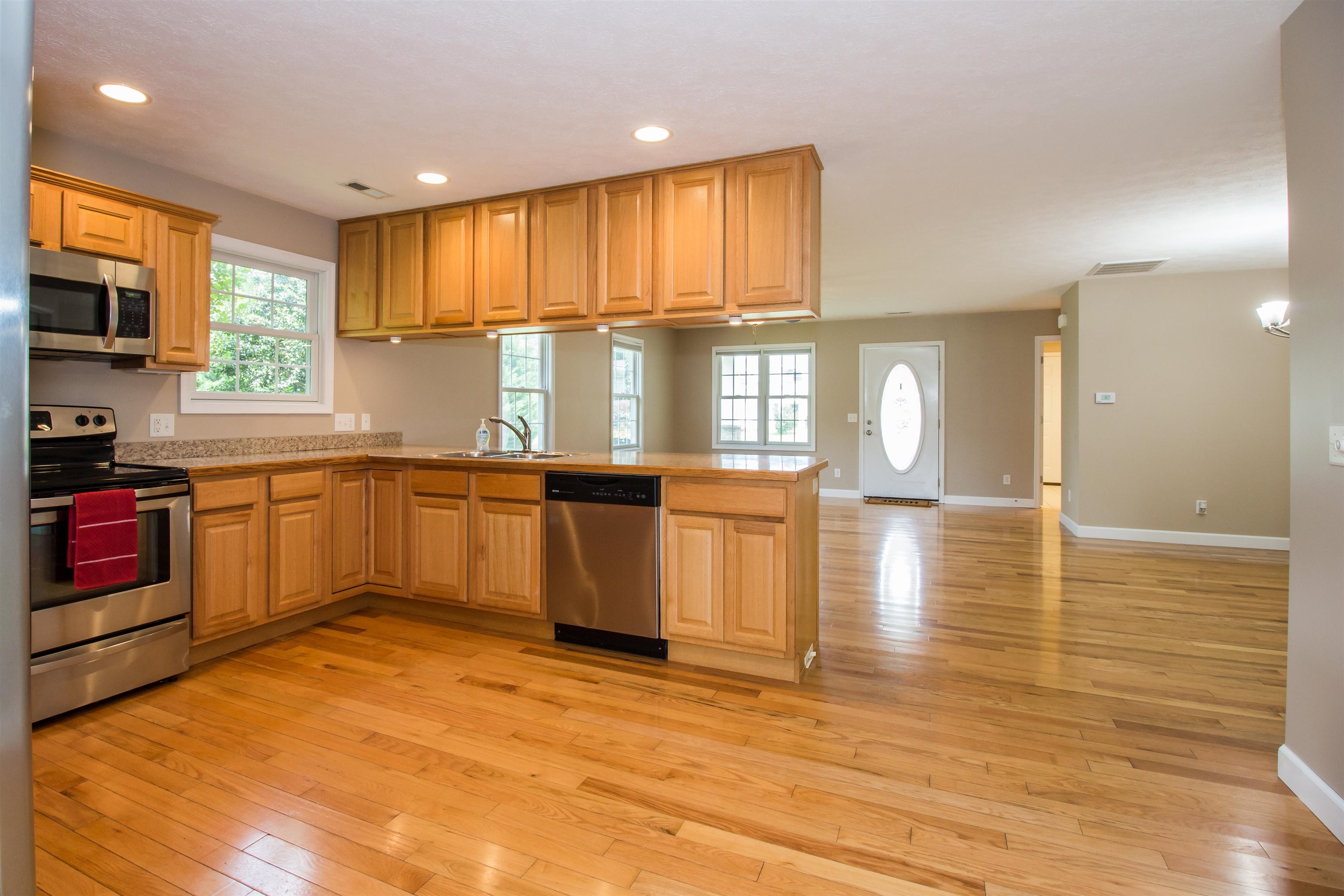 302 A North River Road Bridgewater, VA 22812 - Photo 17 of 24 a large kitchen with stainless steel appliances granite countertop a stove top oven a sink dishwasher and cabinets with wooden floor