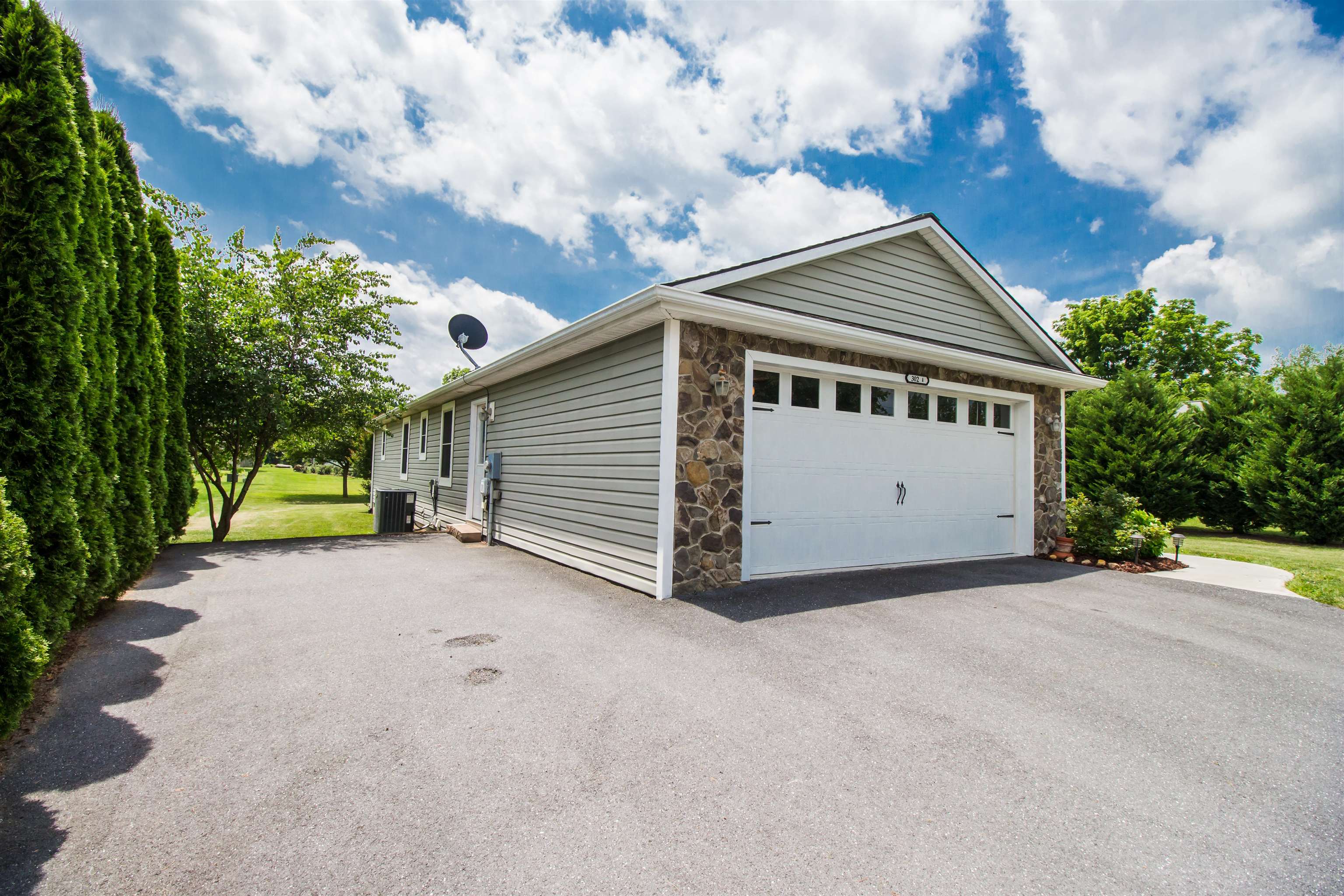 302 A North River Road Bridgewater, VA 22812 - Photo 4 of 24 a view of a house with a yard and garage