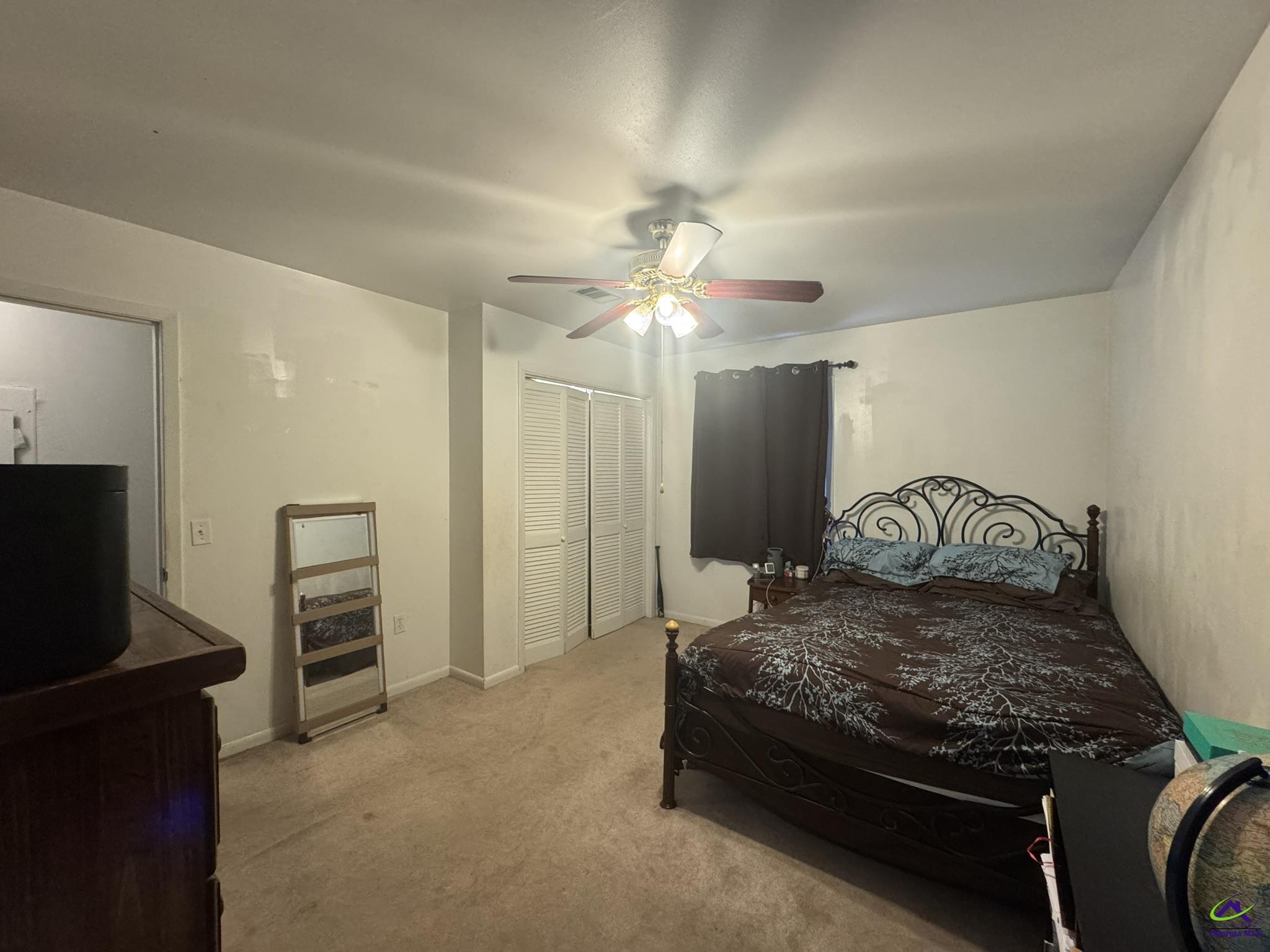 1032 Elberta Road Warner Robins, GA 31093 - Photo 15 of 26 a bedroom with a bed and a television