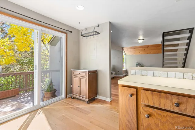 a view of a kitchen with a sink and a large window