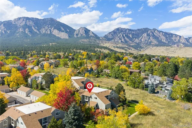 a view of a city with mountains in the background