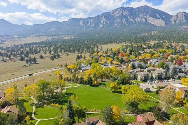 an aerial view of a residential houses with outdoor space