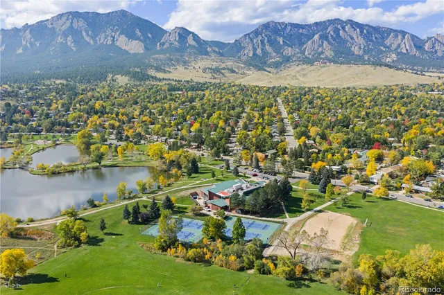 front view of a house with a tree
